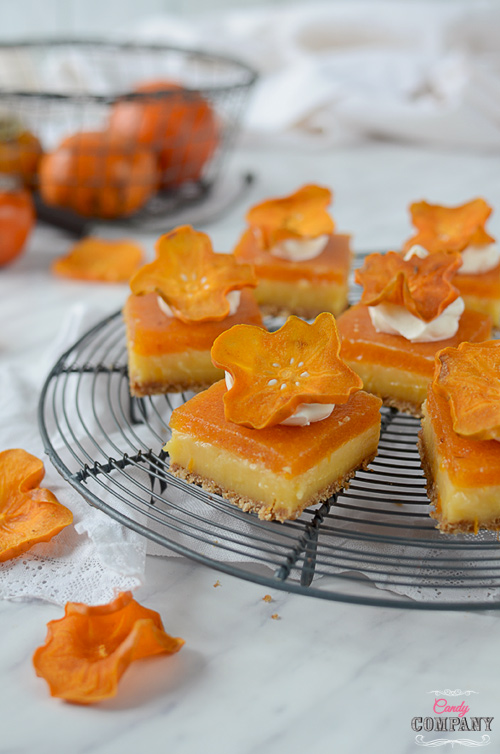 Best lemon bars ever, on grahan crust with creamy lemon curd layer and persimmon mousse. Decorated with whipped cream and dried persimmons