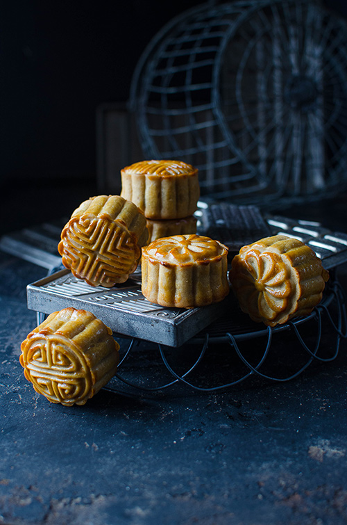 Traditional Chinese moon cake with red bean paste filling and almond cocoa filling