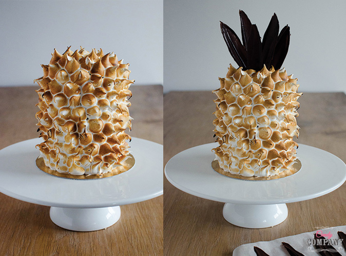 Pineapple like cake with pineapple basil filling, Swiss meringue decoration and chocolate leaves