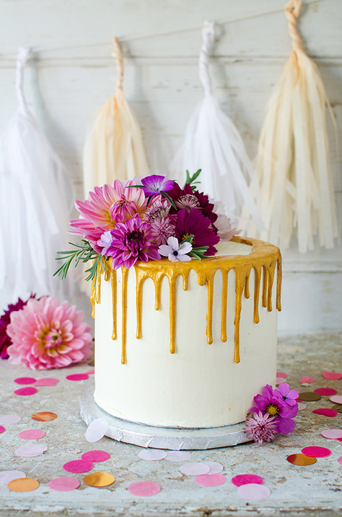 Glamour gold drip birthday cake with fresh flowers arangement