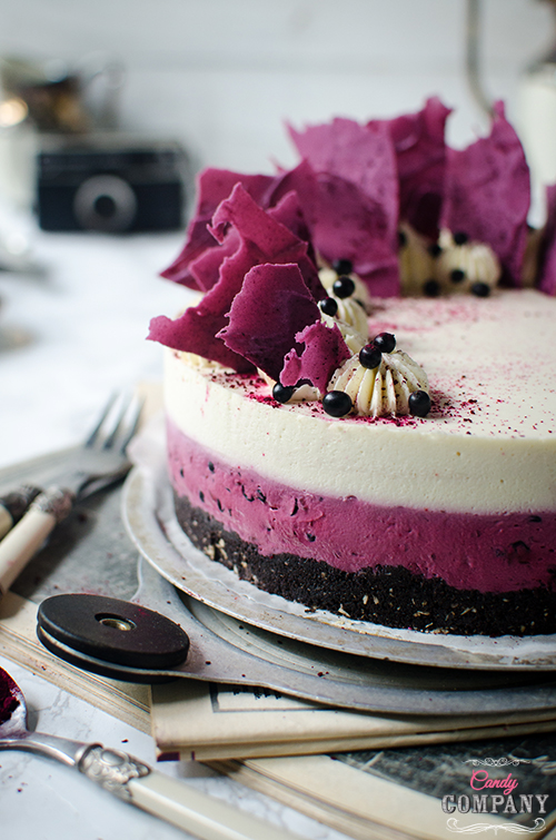 Delicious and easy recipe for no bake elderberry coconut mousse cake on oreo crust and chocolate shatds deocration. Food photography by Candy Company