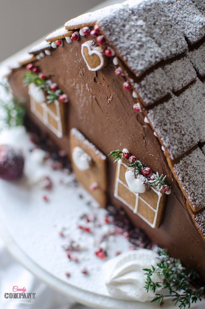 Easy gingerbread house layer cake, with cheesecake layer inside. Food photography by Candy Company